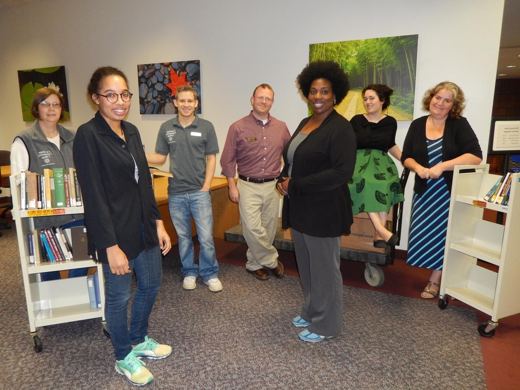 Eastern Campus Library staff with books being sent to Better World Books for reuse or recycling.